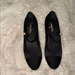 CHANEL Black Flats with Pearl Accent